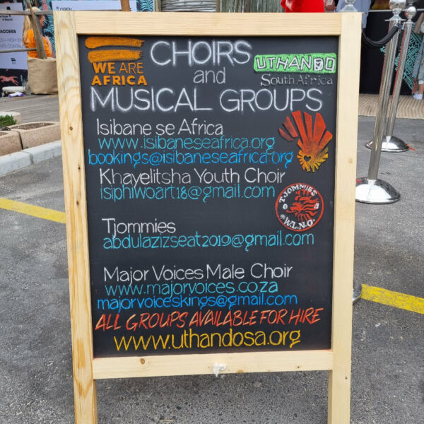 Promotional board with details for all of the choirs